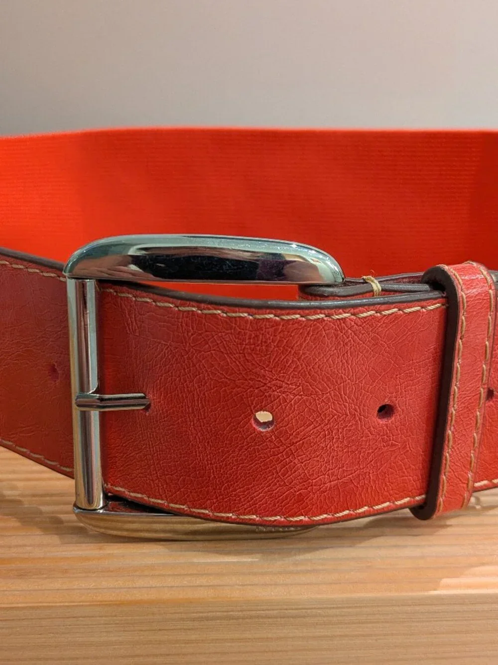 Vibrant red textured leather belt w/ polished silver buckle Medium.